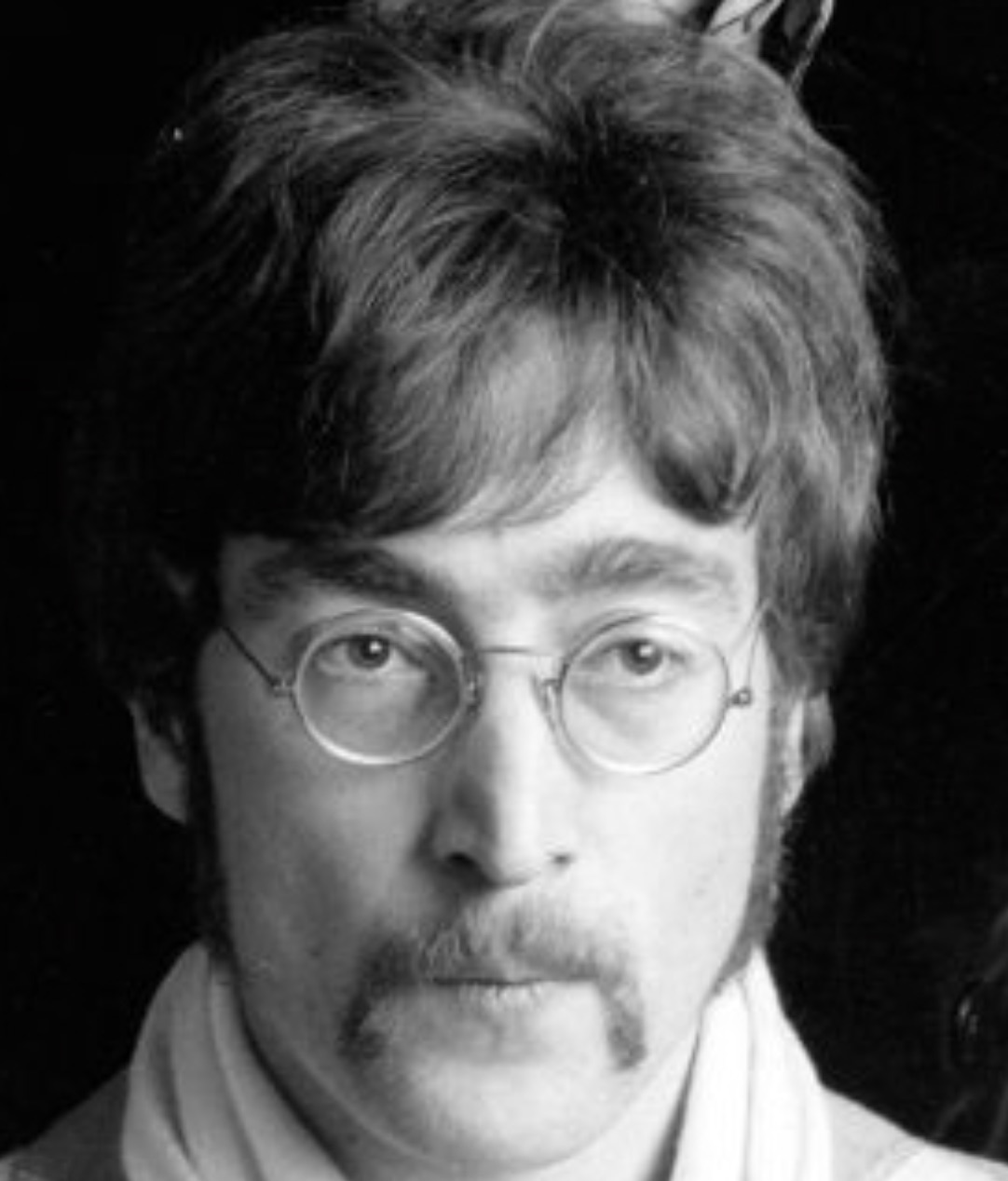 John Lennon with signature glasses and handlebar mustache